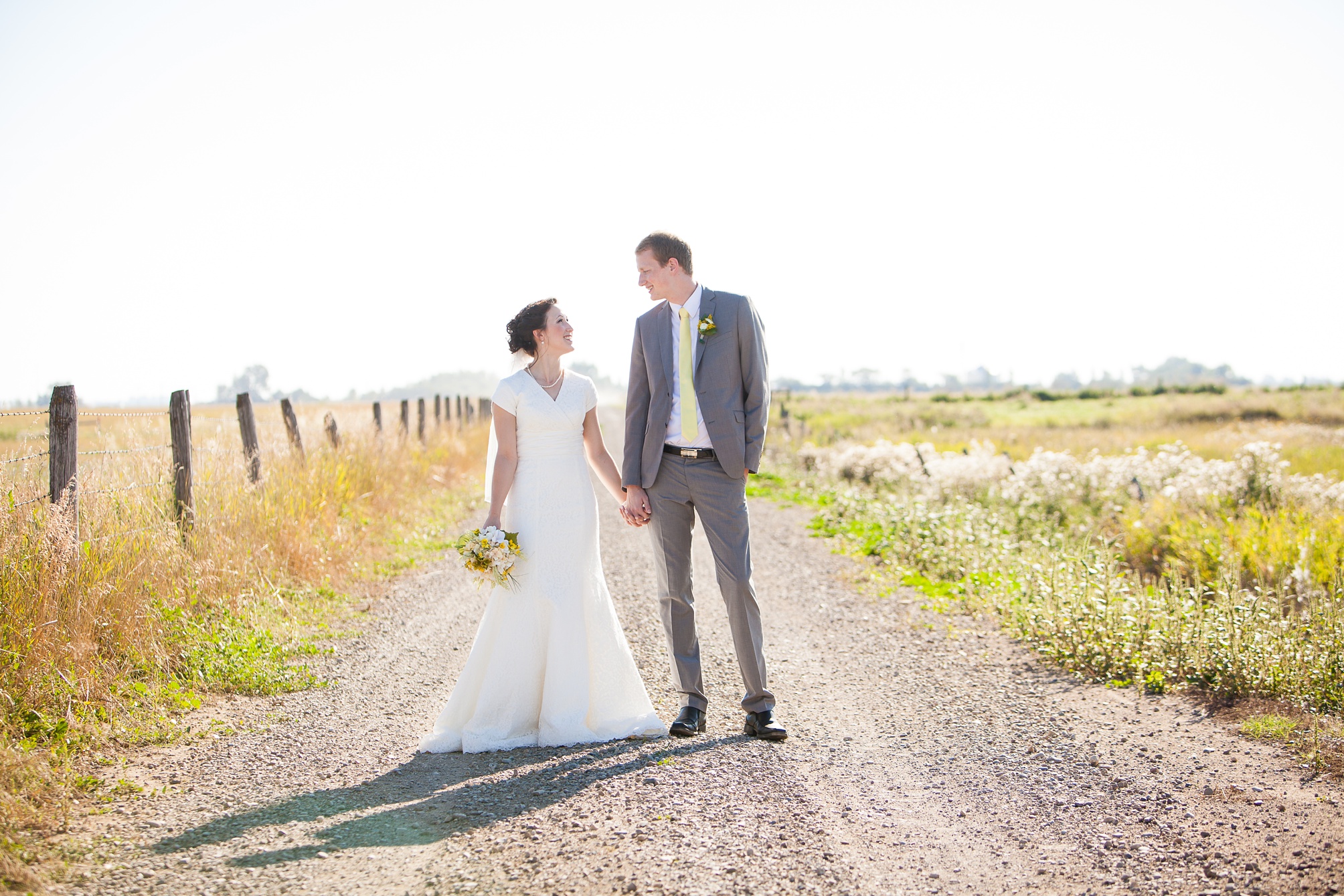 Nathan and Tannis' Cardston yellow and grey springtime Cardston temple wedding, by Kinsey Holt Photography