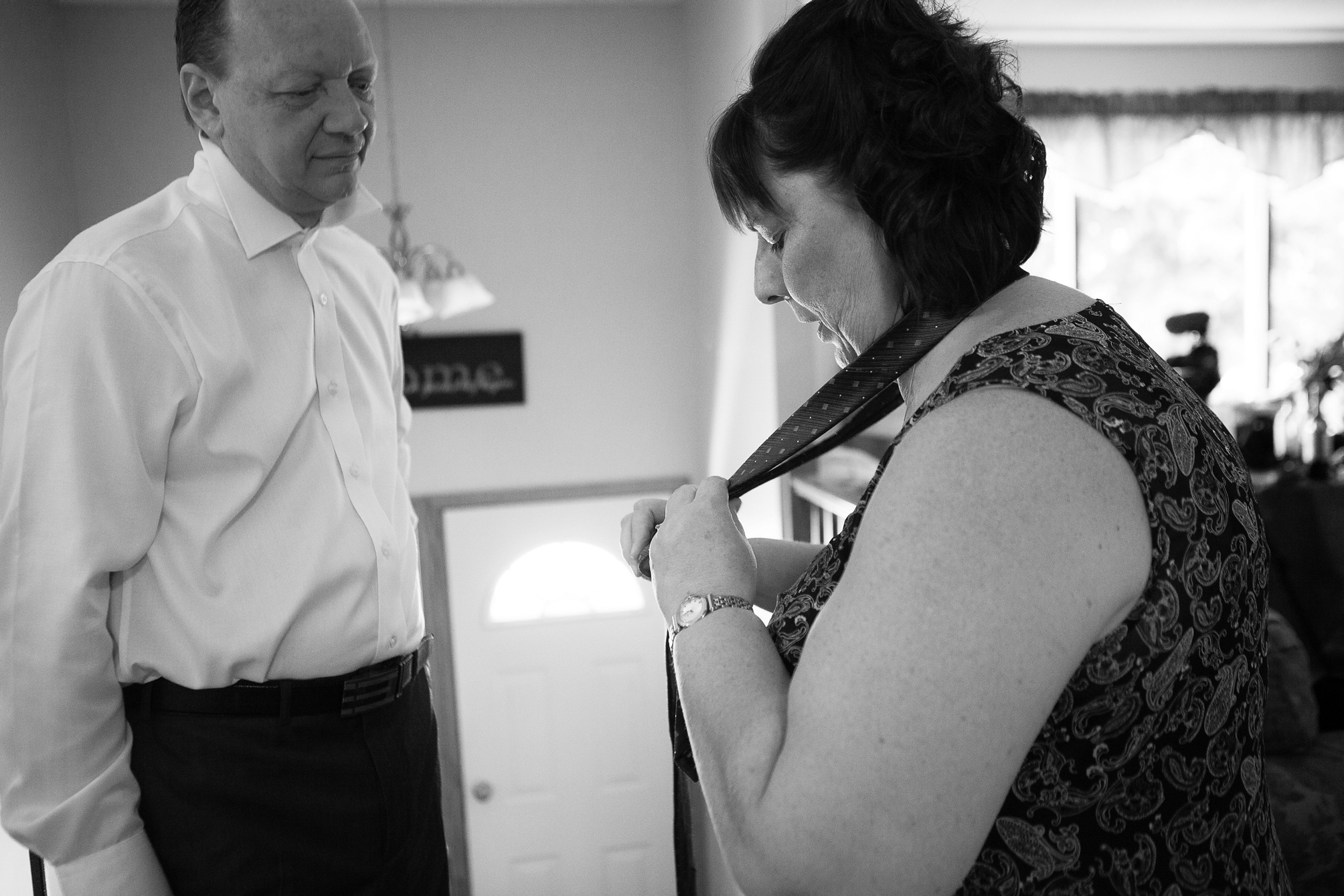 Mom helping dad with tie shot, Kinsey Holt Photography