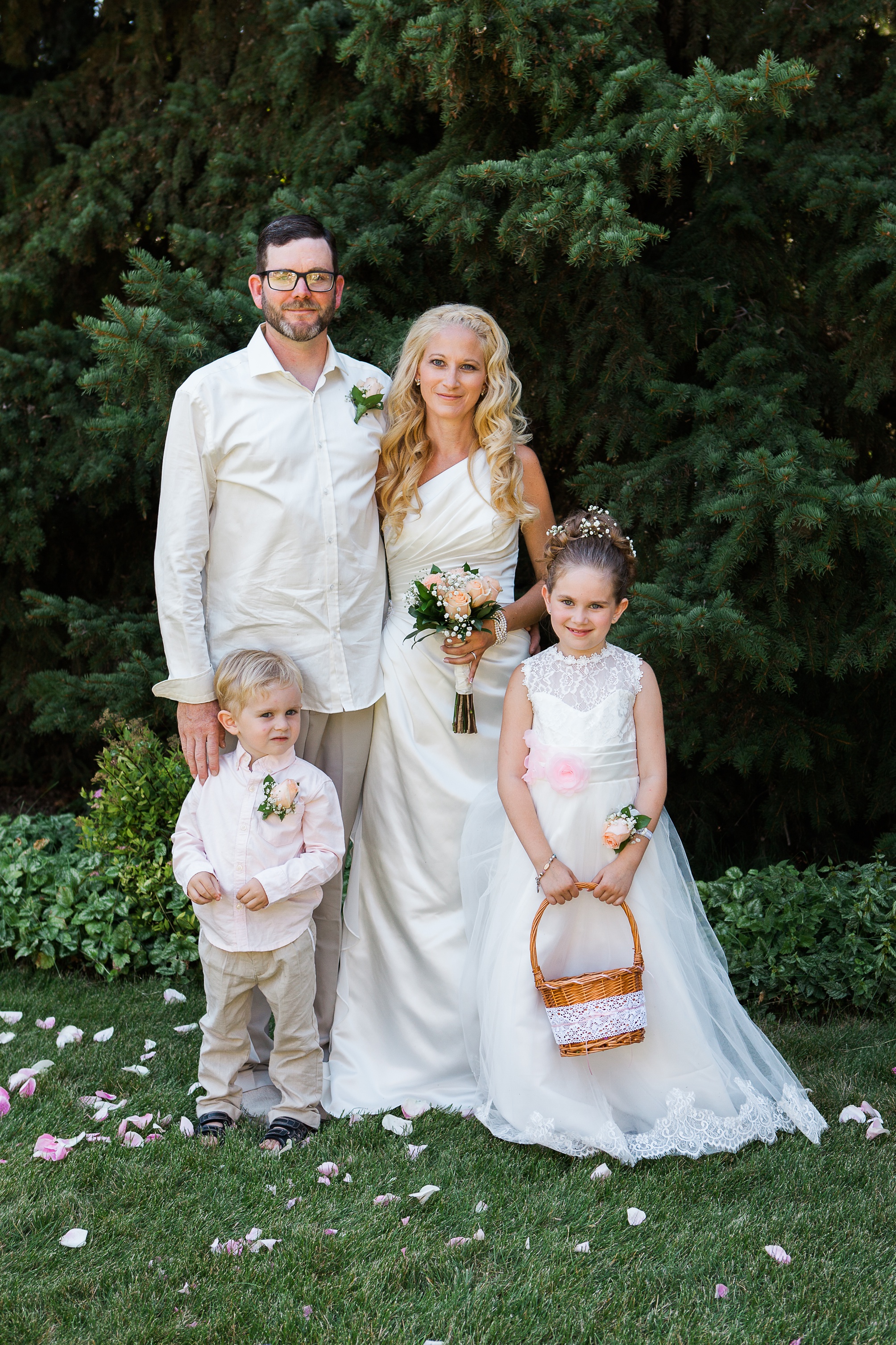 Family photos at this Casual pink and white backyard wedding 