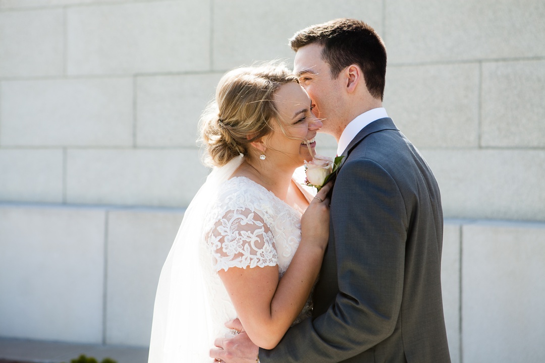 Laughing bride. Blush pink lace wedding dress. Spring Cardston Temple wedding by Kinsey Holt Photography. Southern Alberta wedding photographer. 