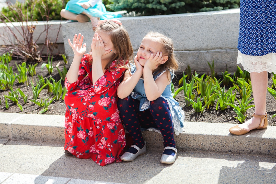 Girls waiting. Spring Cardston Temple wedding by Kinsey Holt Photography. Southern Alberta wedding photographer. 