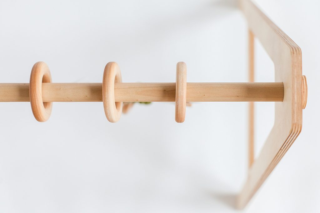 closeup of wood play gym for babies