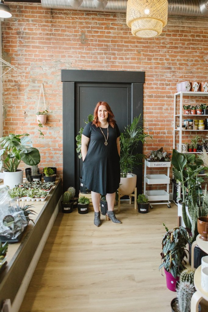 Model in 4Fold Threads t-shirt dress standing in The Sill & Soil plant store
