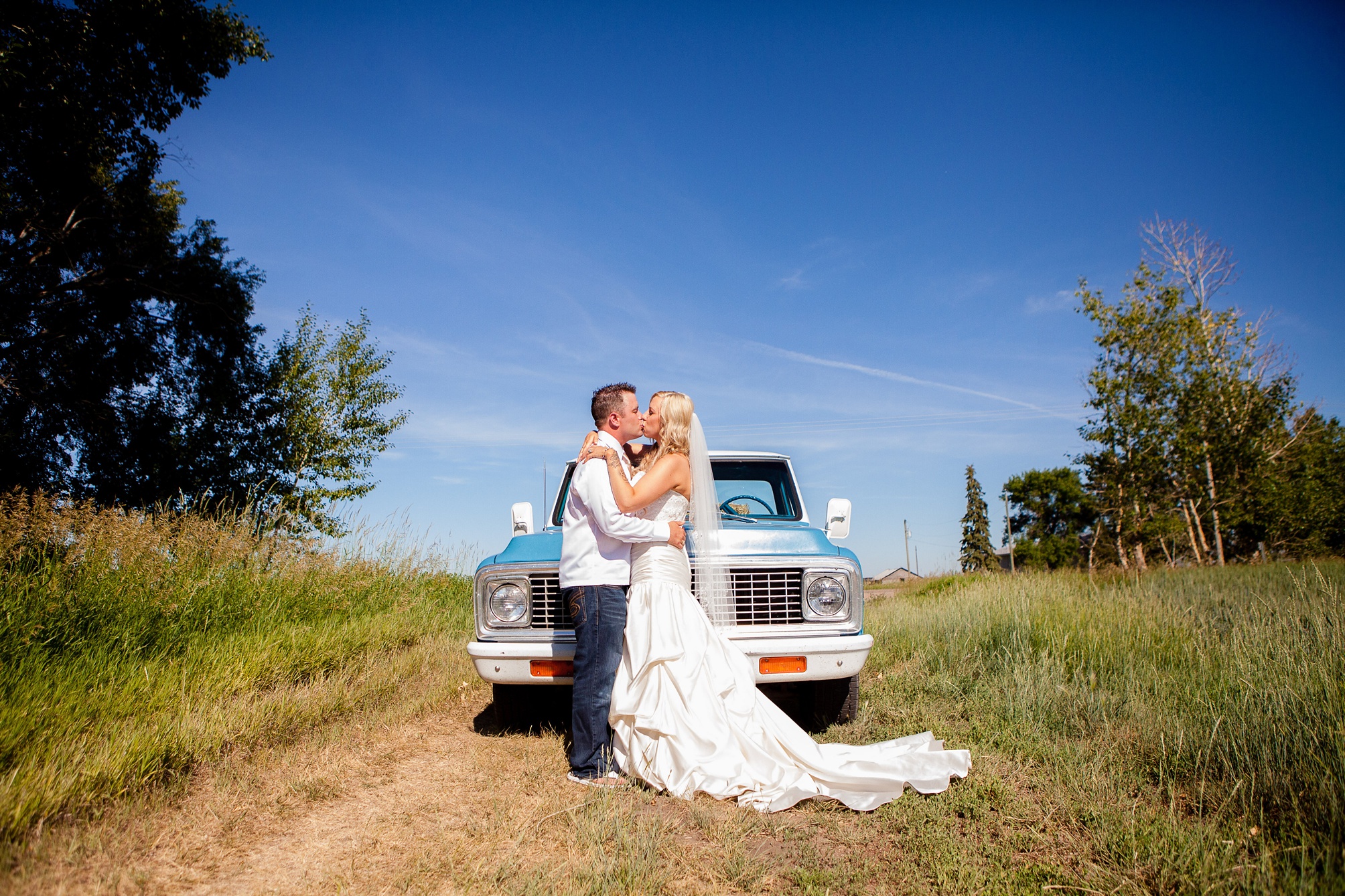 August wedding in Readymade by Kinsey Holt Photography, with blue vintage truck