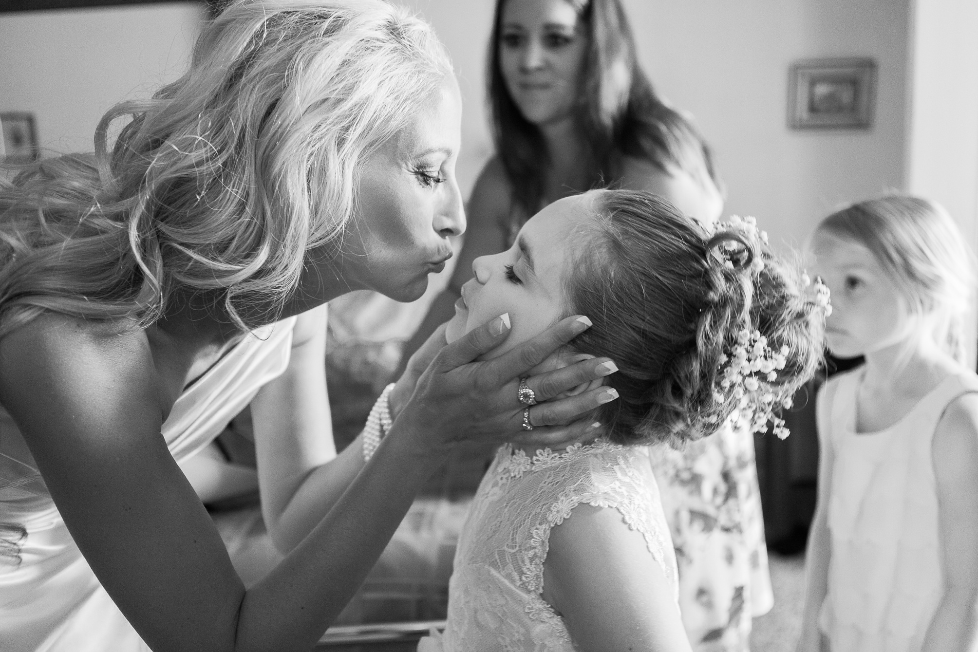 Mother and daughter moment at a Casual pink and white backyard wedding 