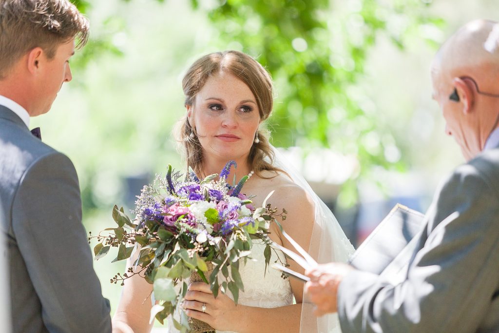 Outdoor ceremony vows Getting ready Southern Alberta wedding photographer Kinsey Holt