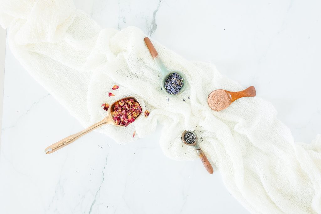 product photo of spoons with soap ingredients in them