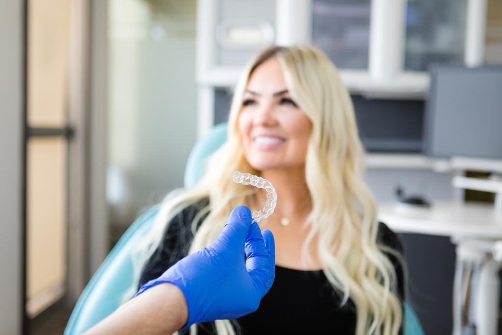 Invisalign trays and female patient for Lethbridge dentist photography