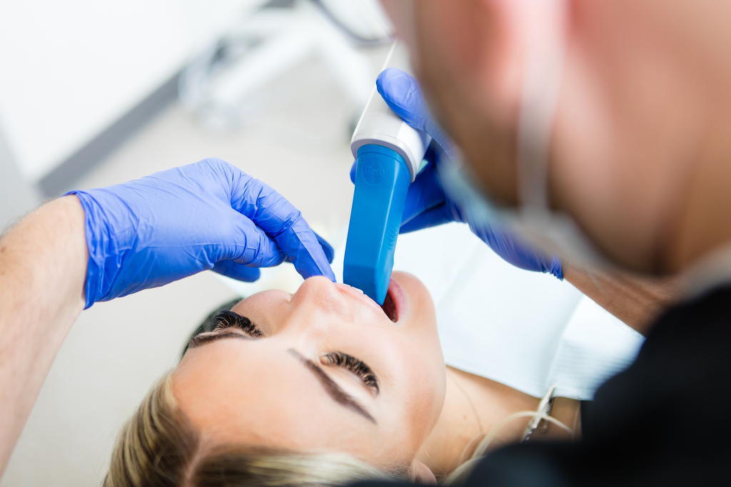 woman receiving dental treatment at Absolute Dental in Lethbridge Alberta