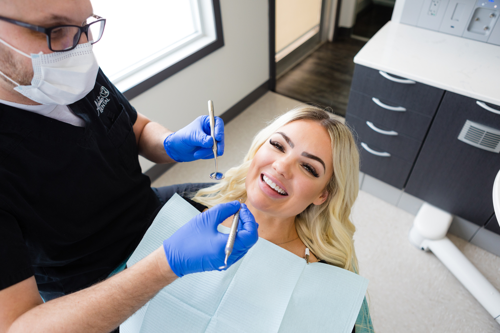 Young blonde woman receiving dental exam at Absolute Dental in Lethbridge Alberta dentist photography