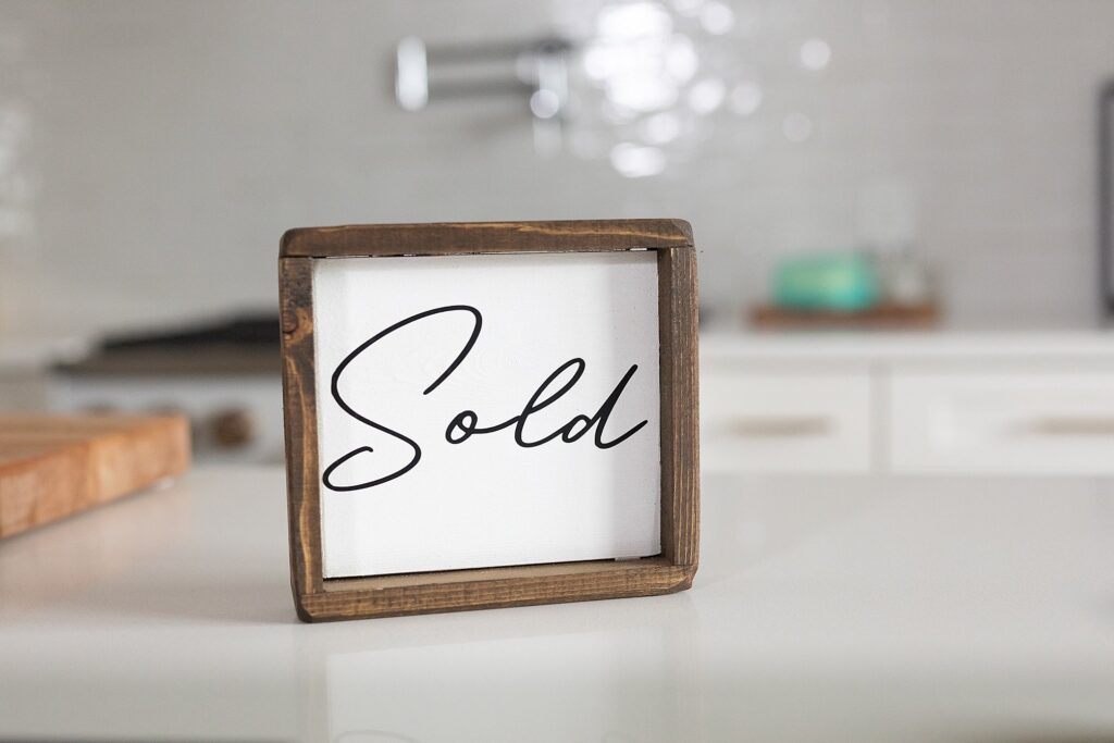 Realtor brand photography can include photos of signs to use for Instagram posts - this one says "Sold"