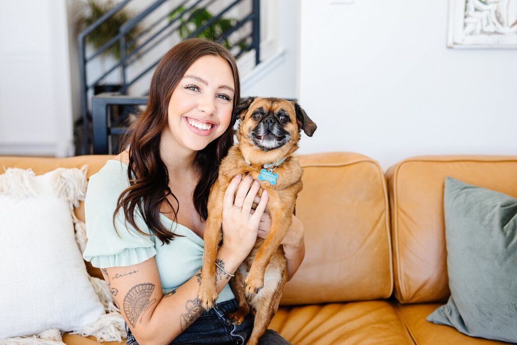 Woman holding dog. Lethbridge brand photography by Kinsey Holt