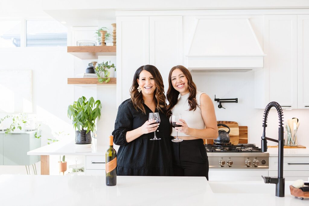 Two designers posing in kitchen. Brand photography by Kinsey Holt