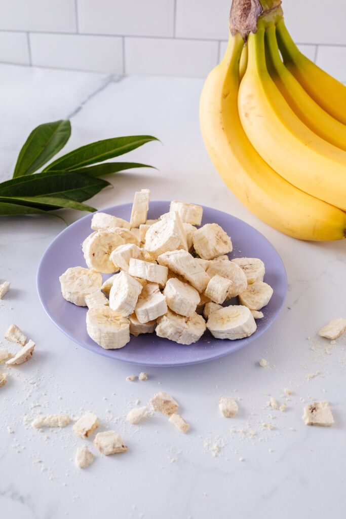 Freeze-dried bananas make a healthy snack! Pictured here on a purple plate. Photo by Lethbridge food photographer Kinsey Holt.